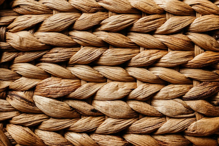 Detailed close-up of a braided natural fiber texture showcasing intricate patterns.